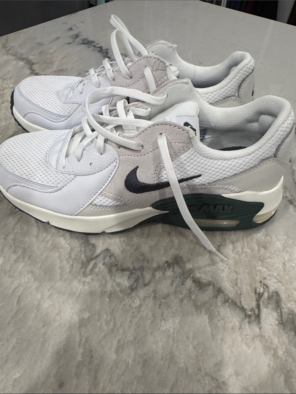 Nike White Sneakers with Dark Green Midsole and Black Swoosh